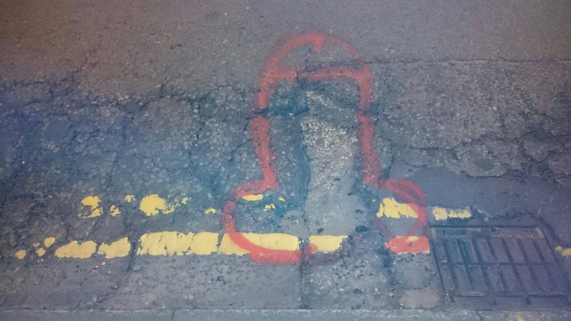 Illustration for article titled Hero Graffiti Artist Gets Potholes Fixed By Drawing Dicks On Them